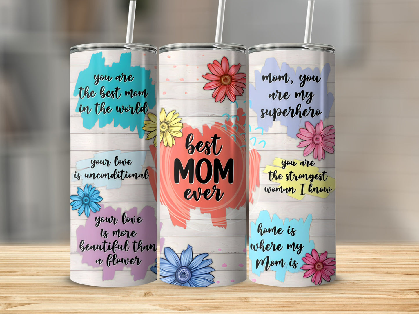 Three tumblers with floral designs and motivational text for mothers.