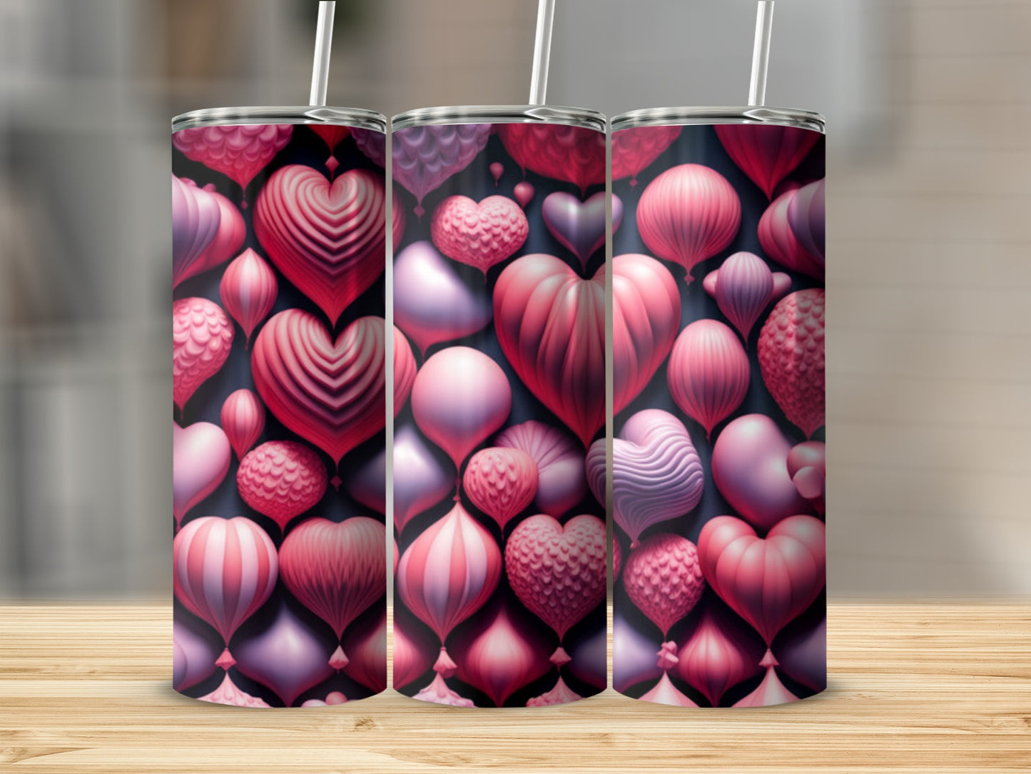 Three tumblers with a repeating pattern of pink and red heart balloons.