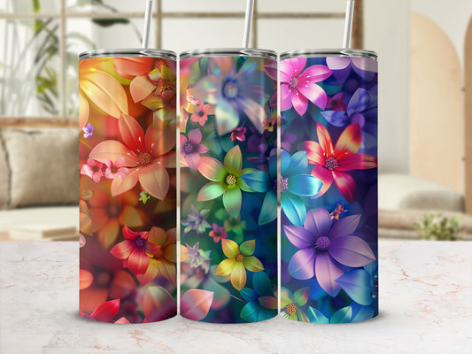 Three tumblers with colorful floral patterns.