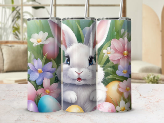 Three Easter bunny tumblers with pastel eggs and flowers.