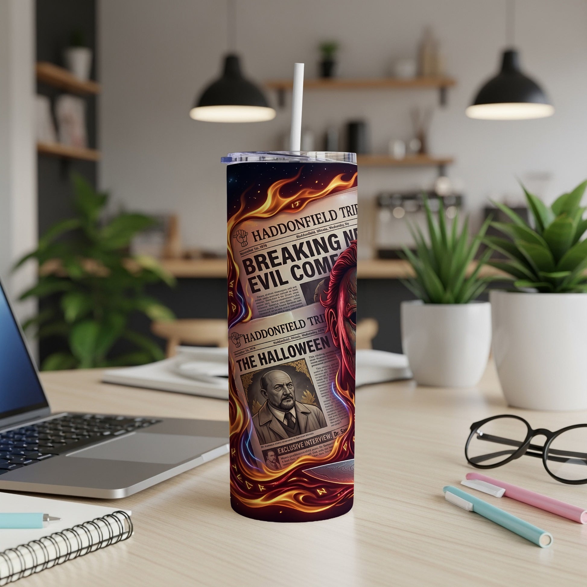 Tumbler with newspaper headlines "Breaking Evil Come" and "The Halloween" and flame graphics.