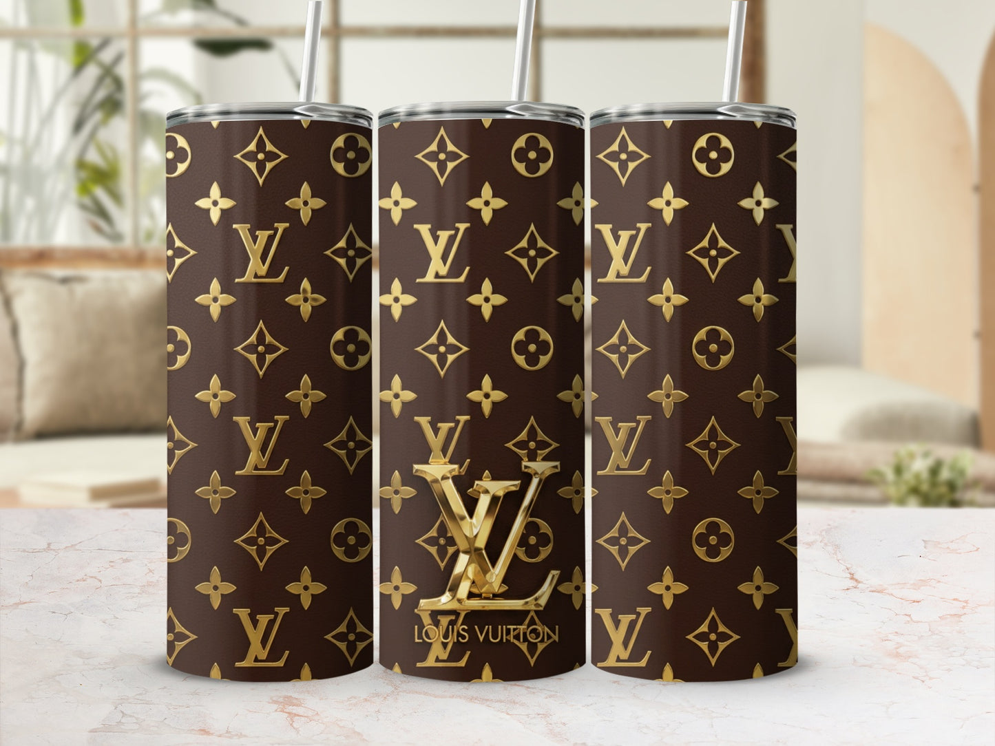Tumblers with a brown Louis Vuitton monogram pattern and gold accents.