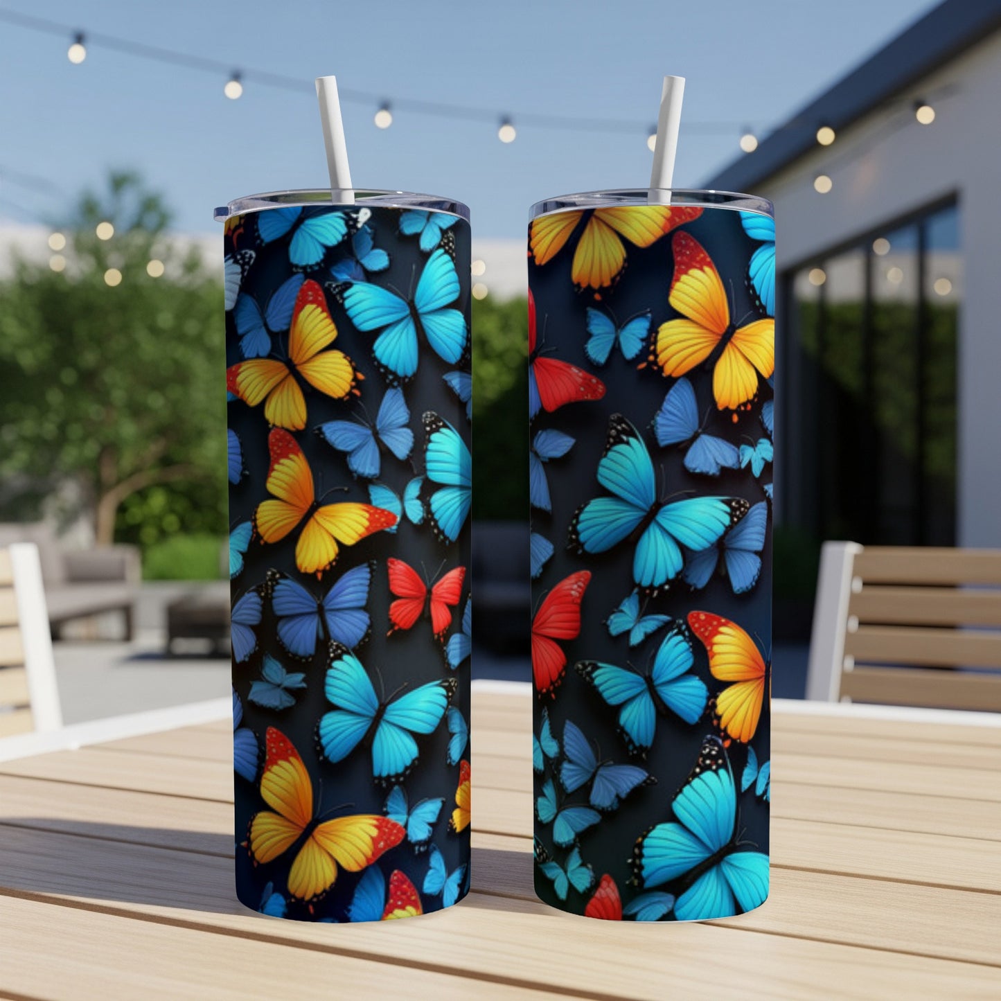 Two tall tumblers with a colorful butterfly pattern.