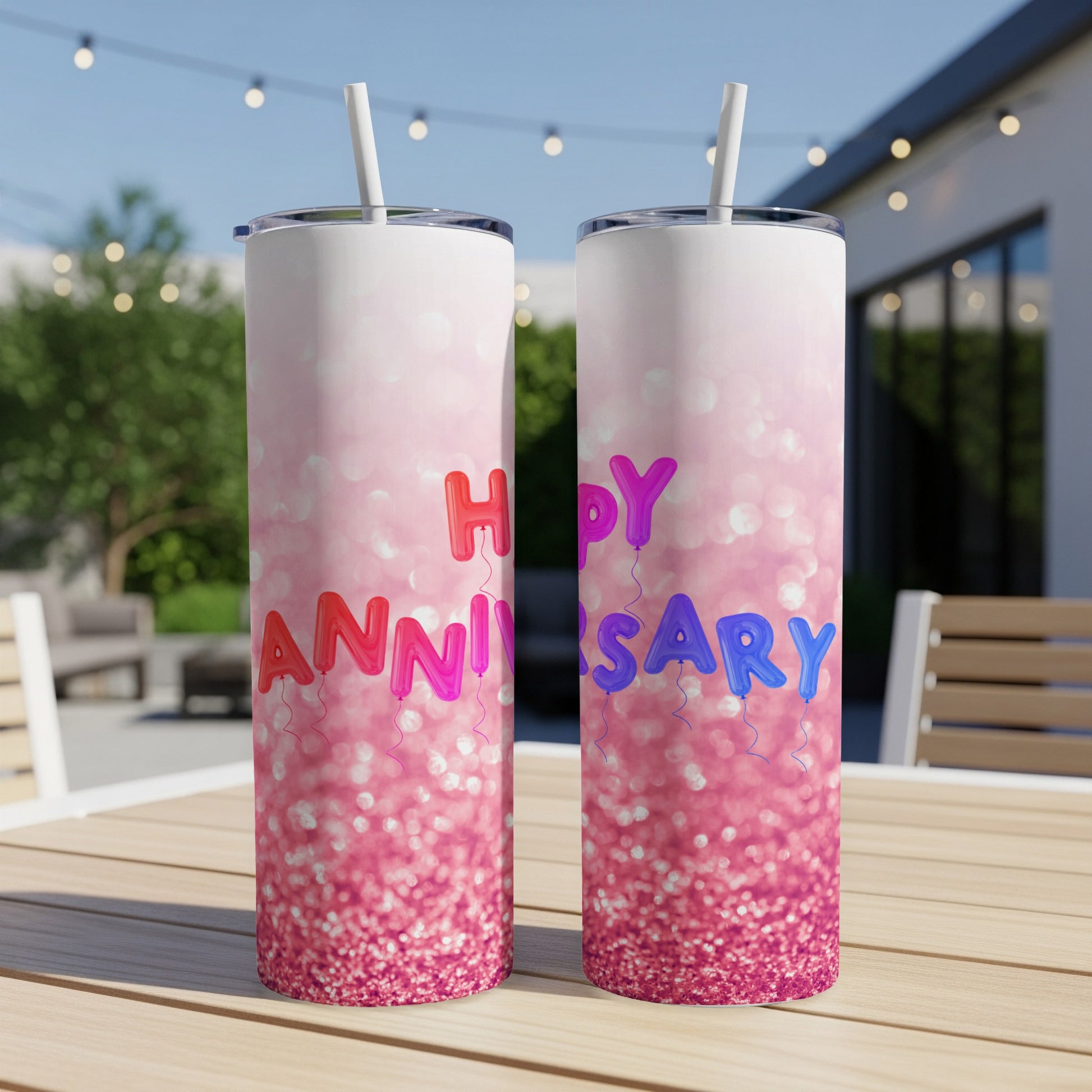 Two tall tumblers with pink glitter and "Happy Anniversary" text.