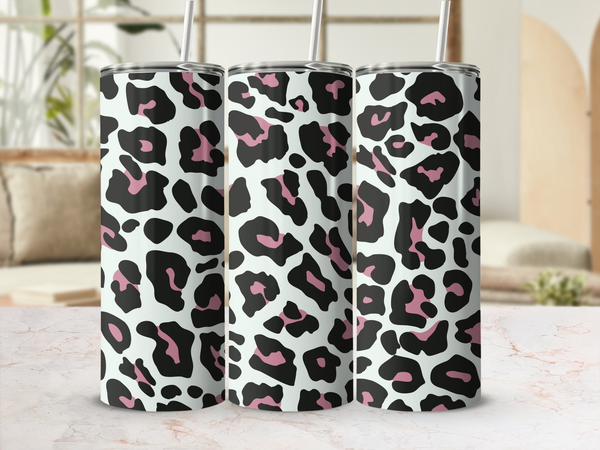 Three tumblers with a black and pink leopard print design.