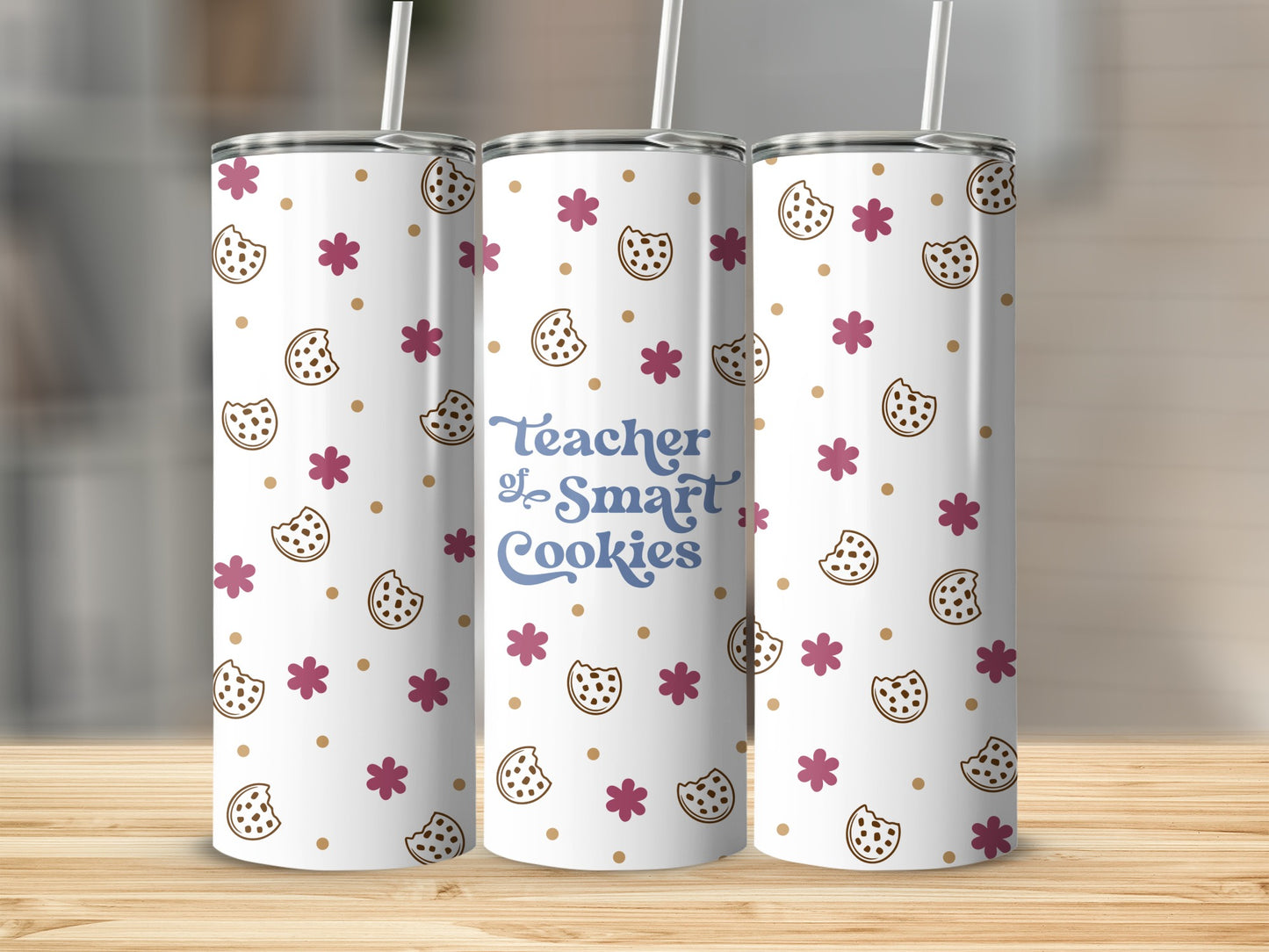 Tumbler with "Teacher of Smart Cookies" text and cookie and flower pattern.