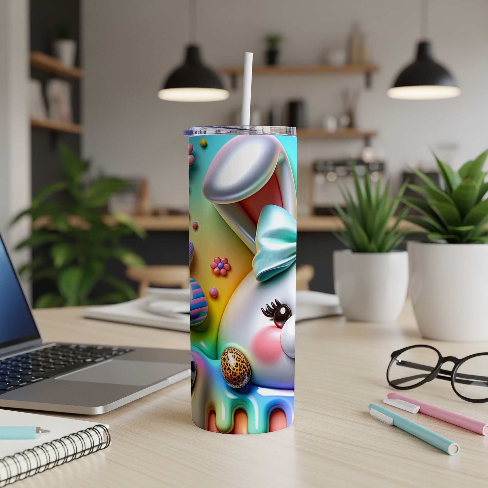 Easter bunny tumbler with colorful eggs and bow on a desk.