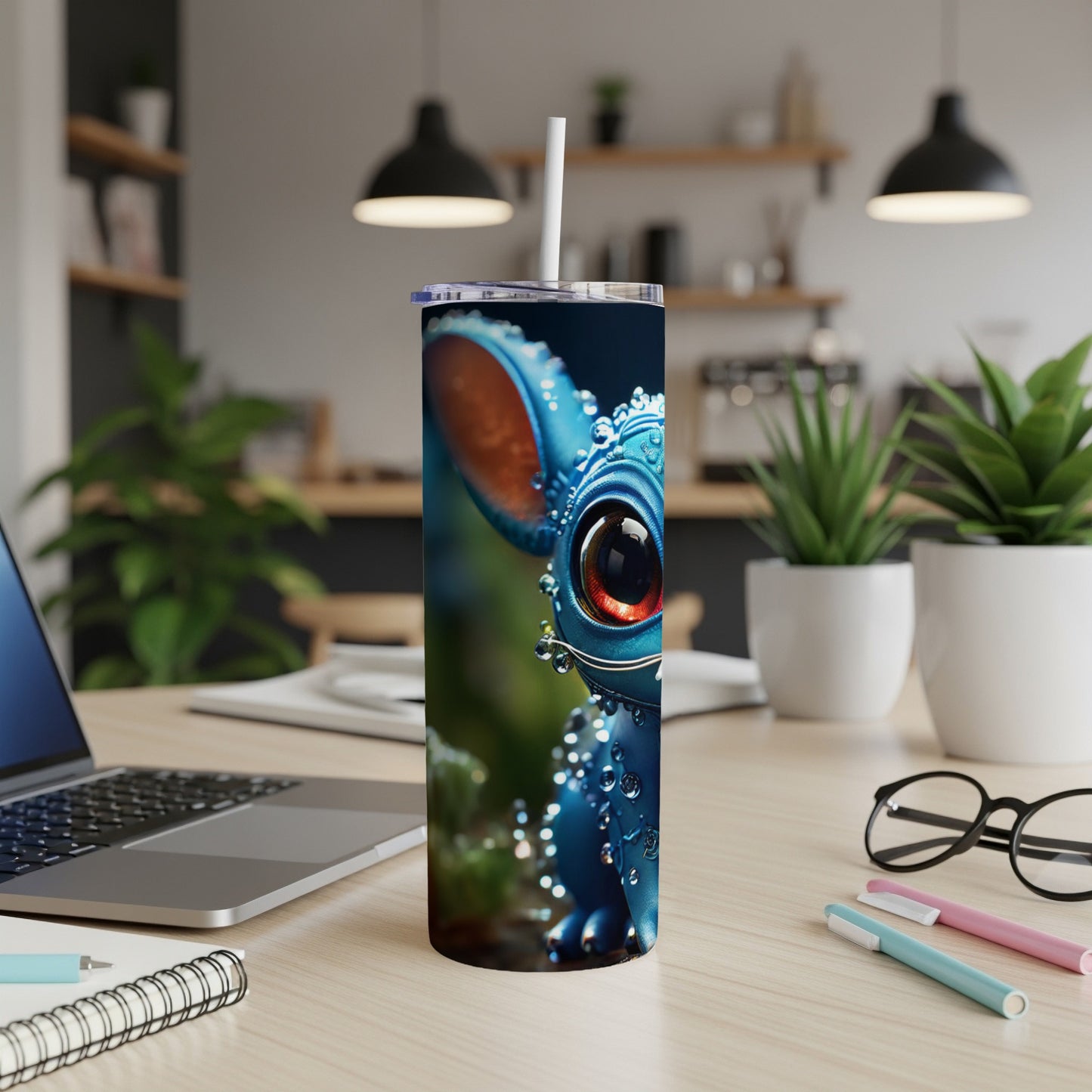 Blue cartoon creature with large red eyes on a tumbler.