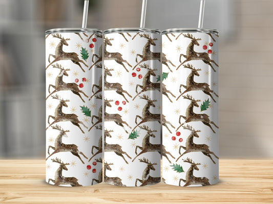 Three tumblers with a watercolor reindeer and holly pattern.