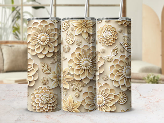 Three floral patterned tumblers with straws, against a soft background.