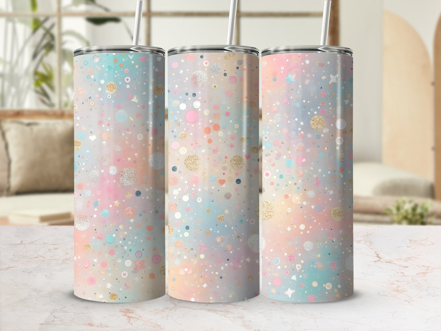 Pastel confetti pattern on three tall, slim tumblers with straws.