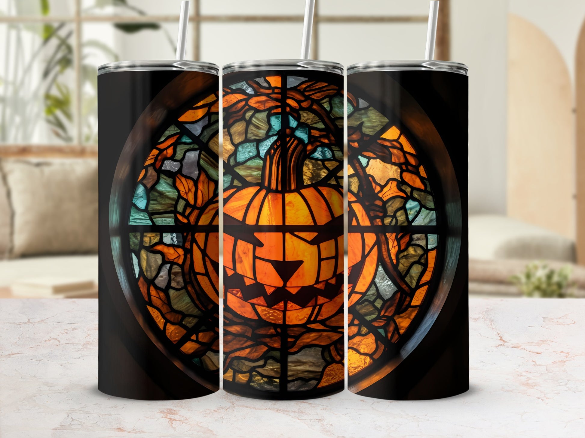 Three tumblers with a stained-glass Halloween pumpkin design.