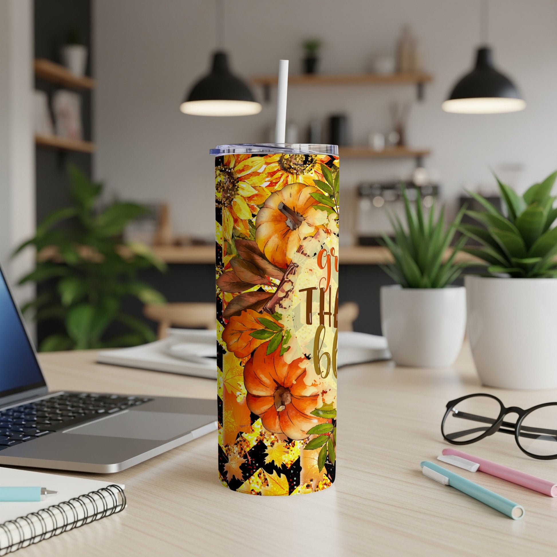 Tall tumbler with pumpkin and sunflower design, "So Grateful" text.