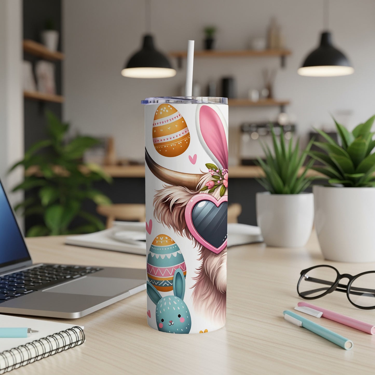 Easter-themed tumbler with bunny and cow designs, featuring pastel eggs.
