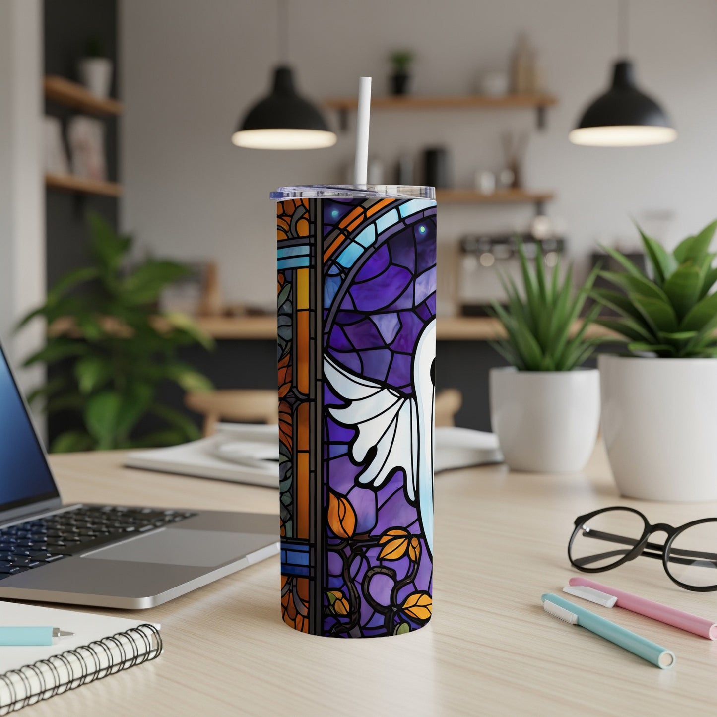 Tall tumbler with stained glass design featuring a white angel and purple accents.