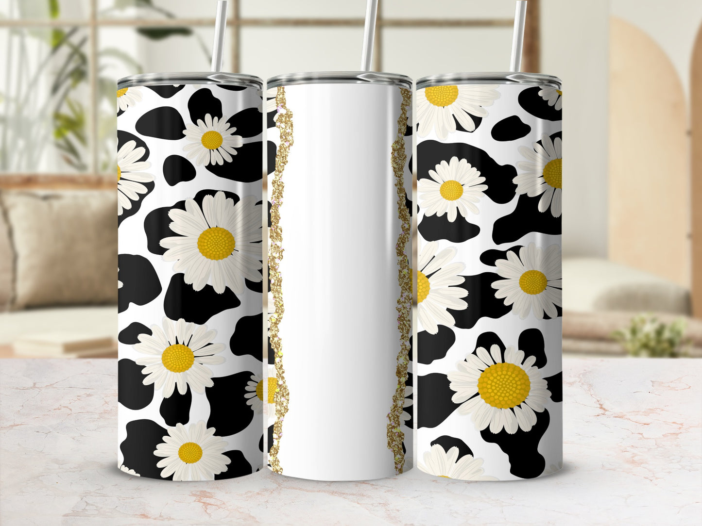 Three tumblers with black and white cow print and white daisy pattern.