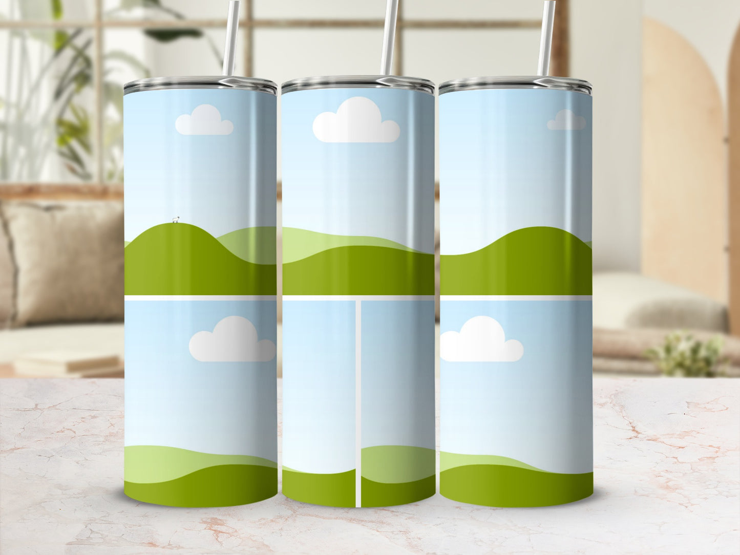 Three tumblers with a green hill and sky design, one with tiny sheep.