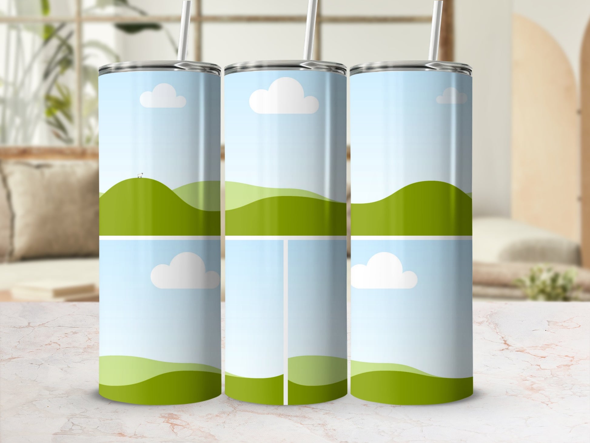 Three tumblers with a green hill and sky design, one with tiny sheep.