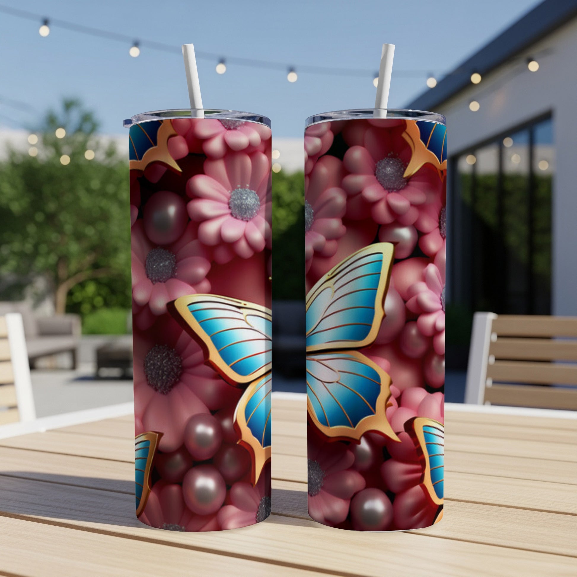 Two tall tumblers with blue butterfly and pink flower pattern.