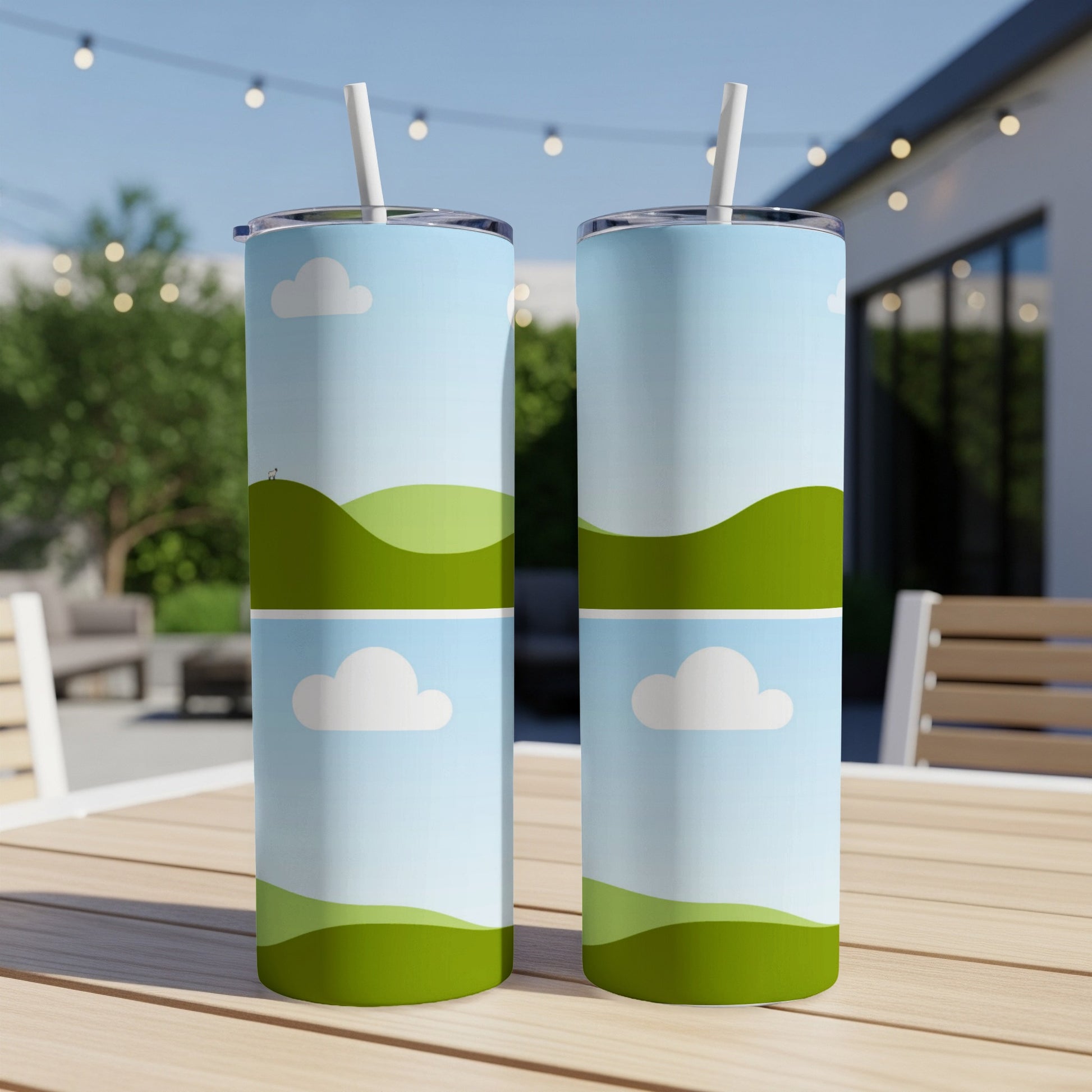 Two tumblers with a blue sky and green rolling hills design.