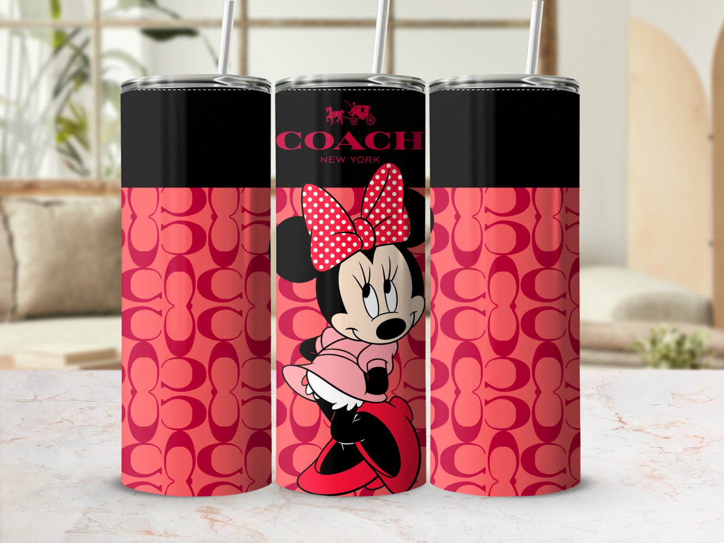 Coach New York tumbler with Minnie Mouse and repeating C logo print.