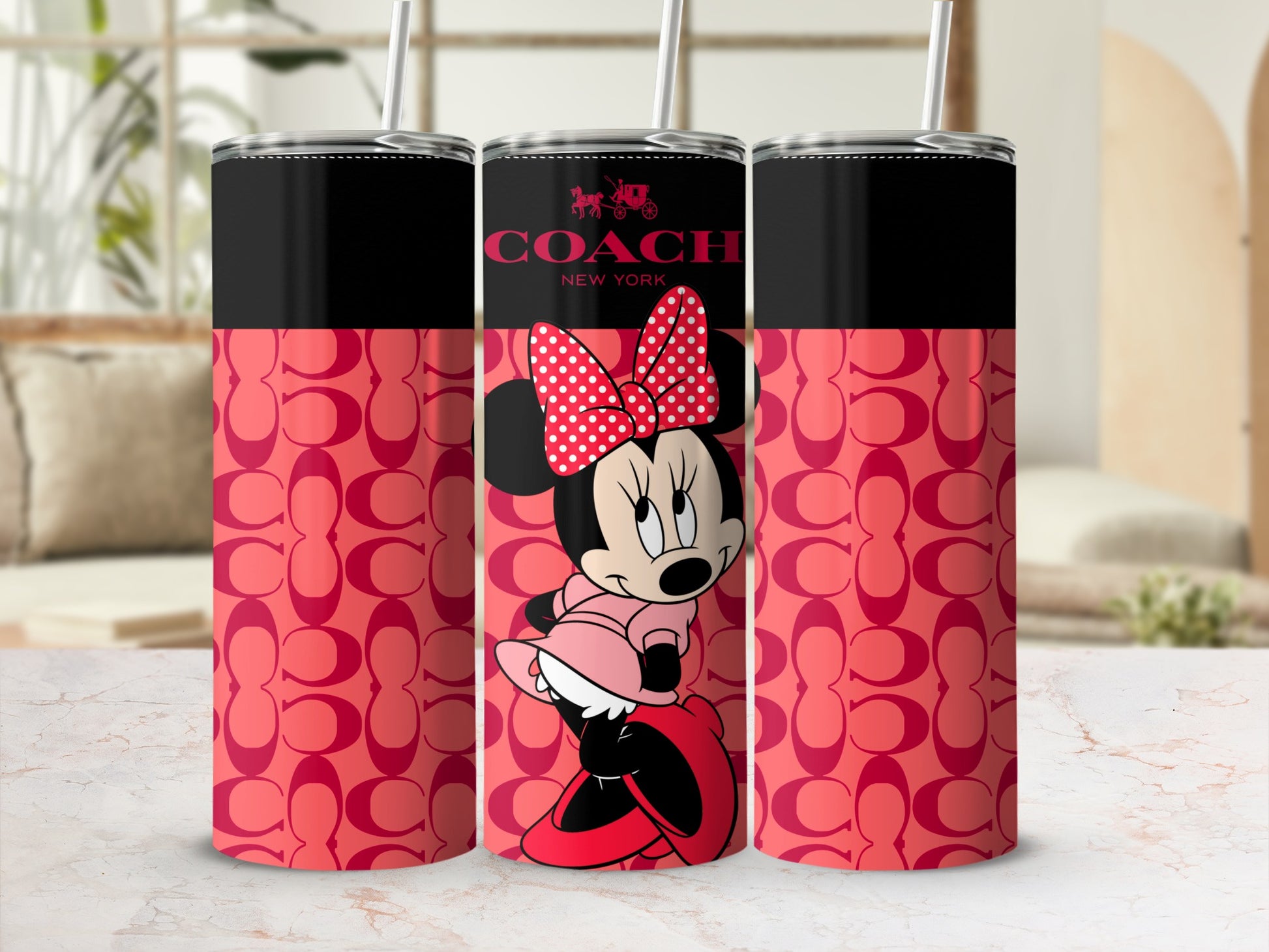 Coach New York tumbler with Minnie Mouse and repeating C logo print.