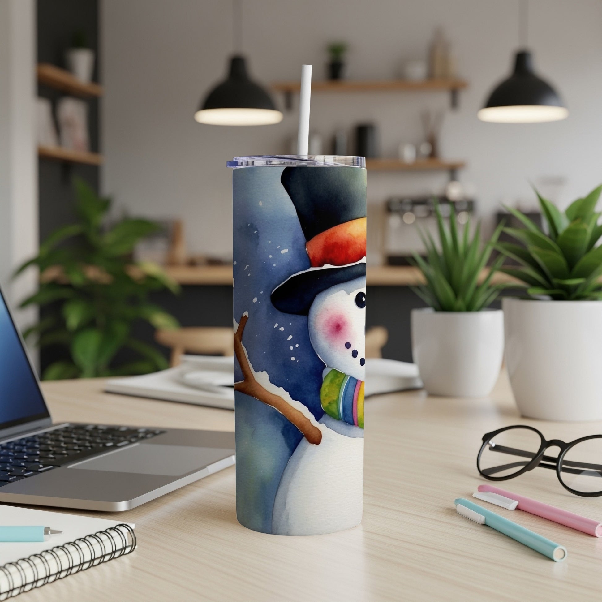 Watercolor snowman with a colorful scarf on a tumbler.