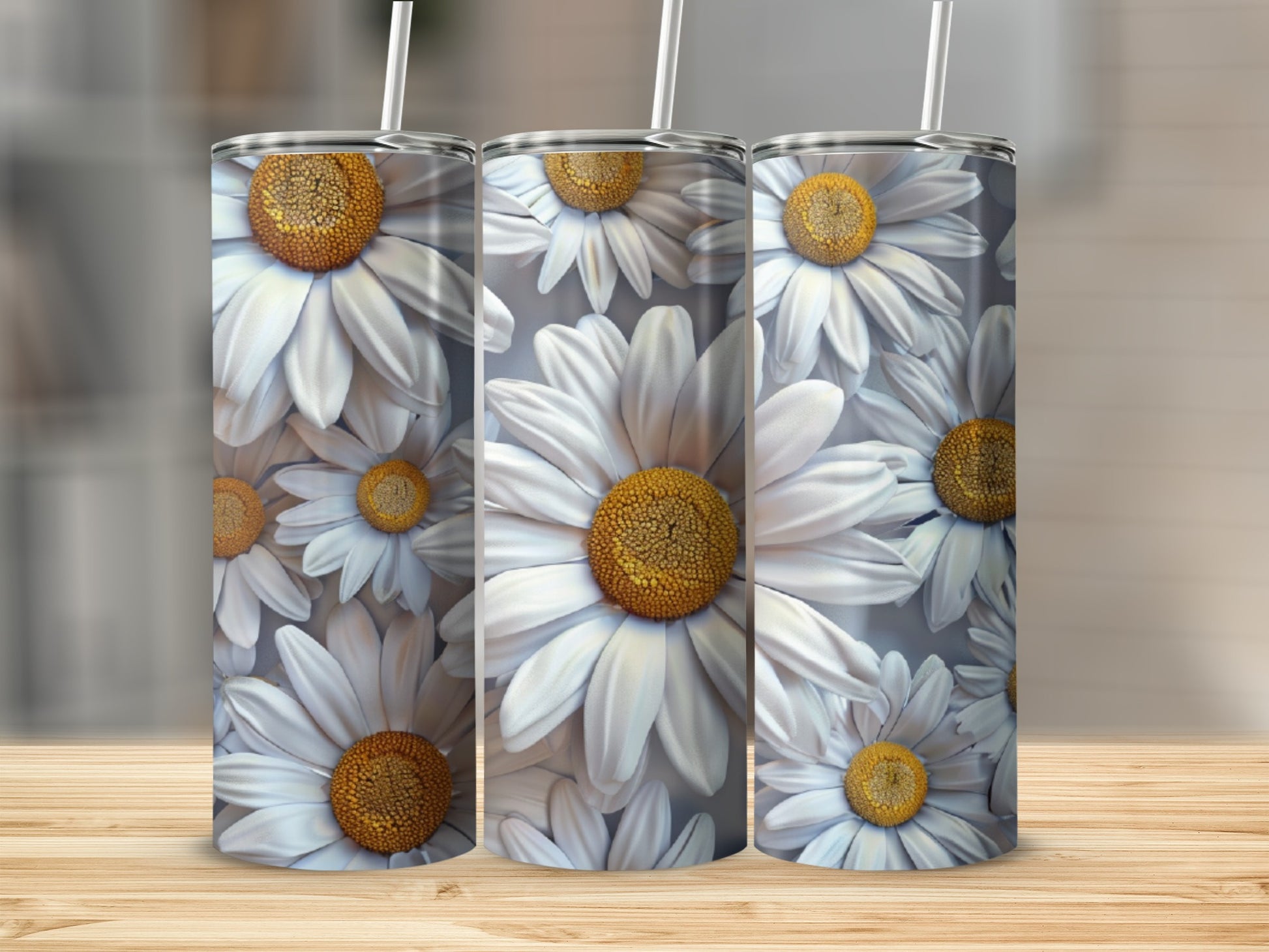 Three tumblers with a white daisy floral pattern.