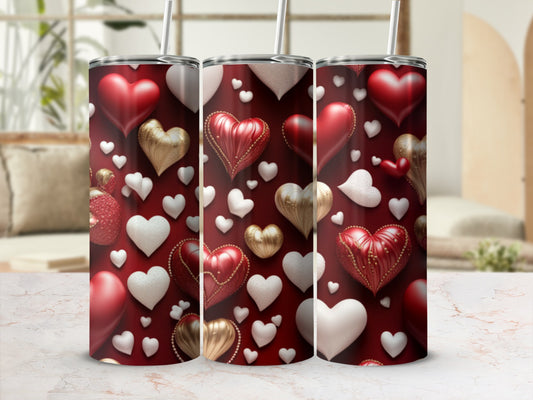 Three red tumblers with a pattern of hearts in red, gold, and white.