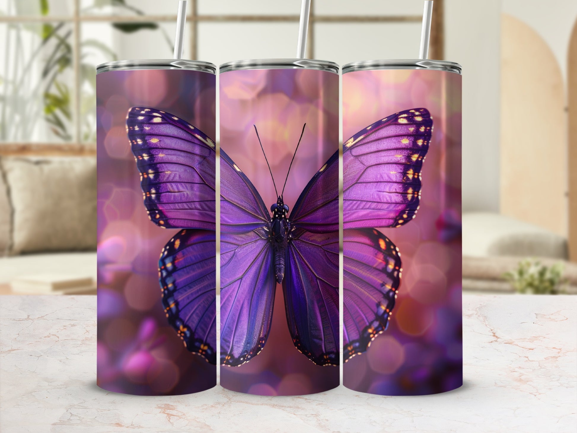 Purple butterfly design on three tumblers with bokeh background.