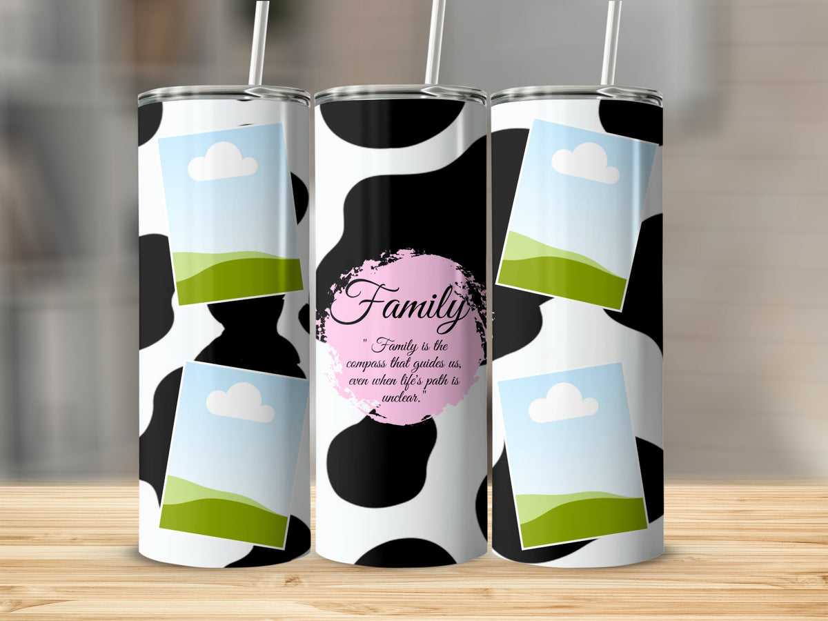 Three tumblers with cow print, framed photos, and "Family is the compass" quote.