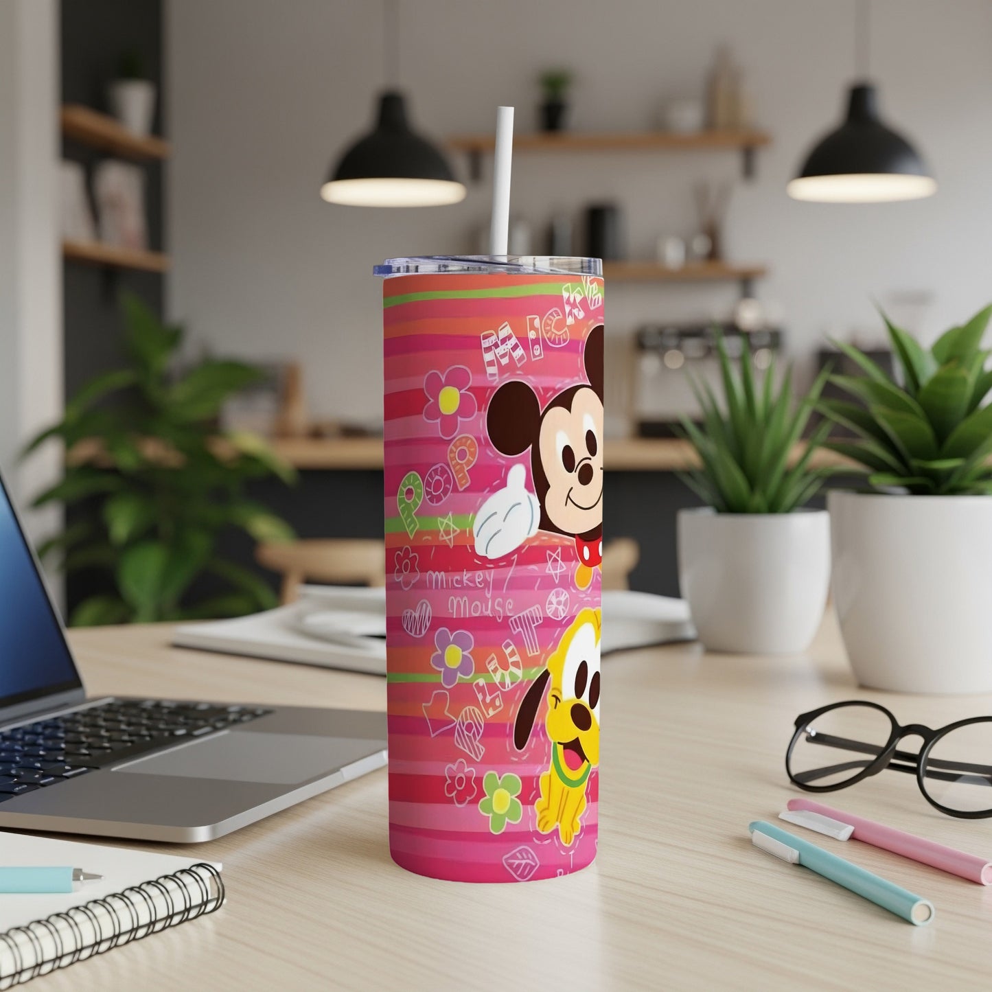 Mickey Mouse and Pluto on a pink striped tumbler with floral designs.