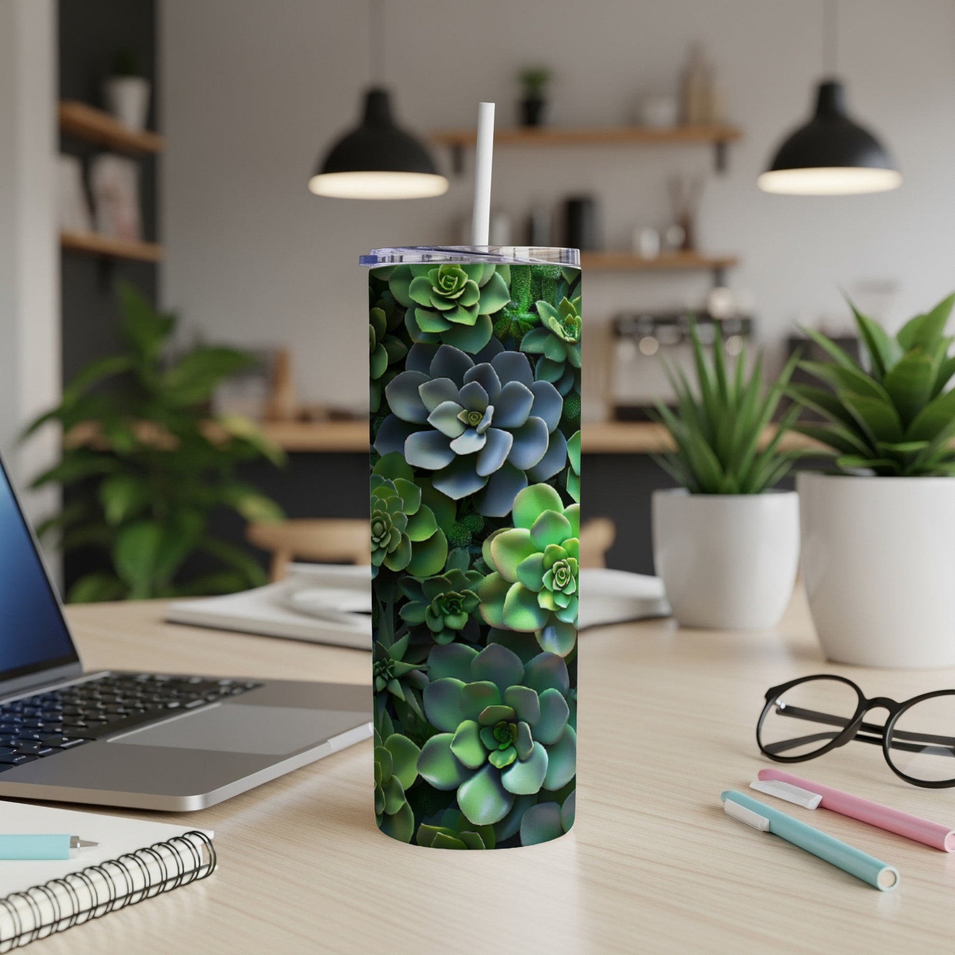 Green succulent pattern on a white tumbler with a straw.