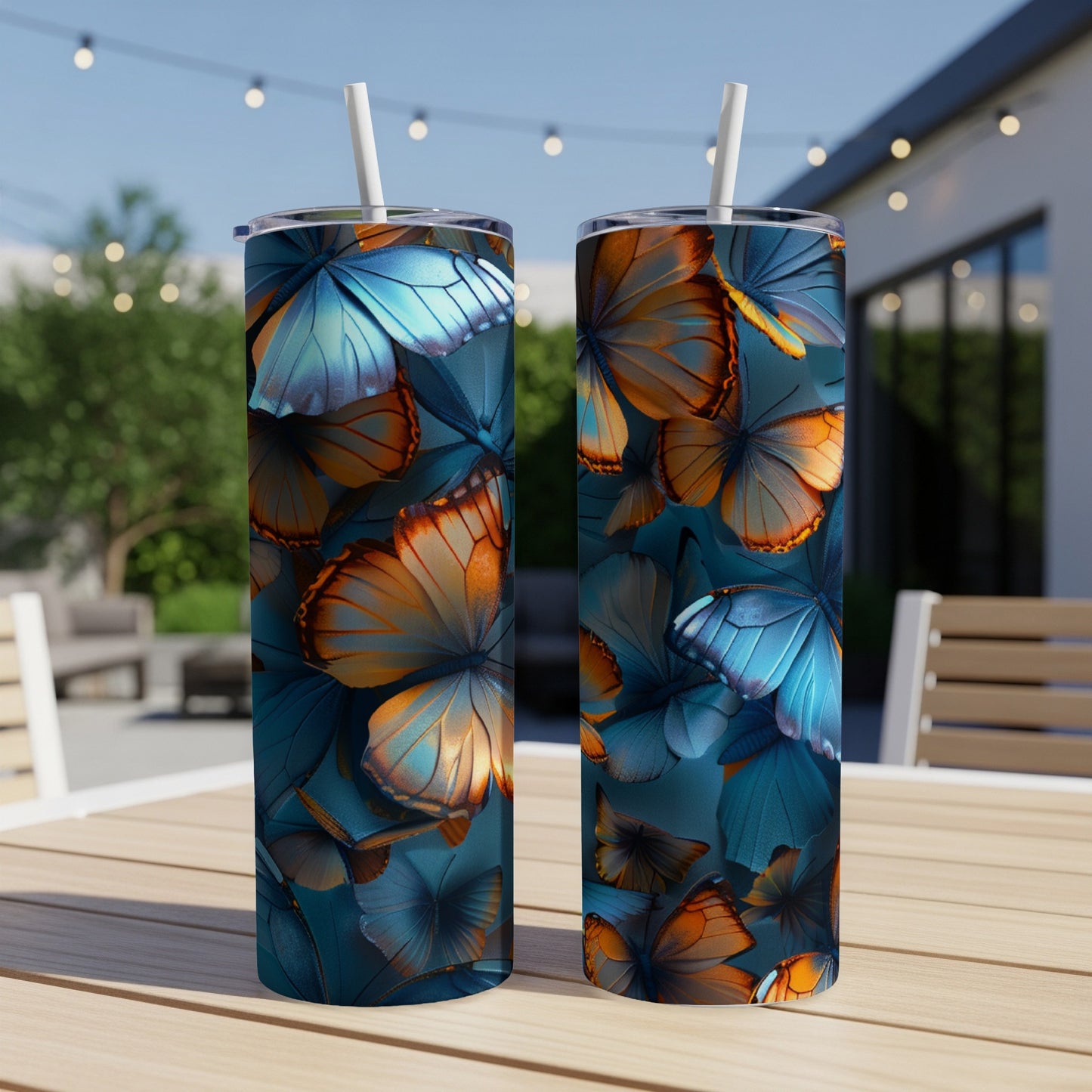 Two tumblers with a blue and orange butterfly pattern.