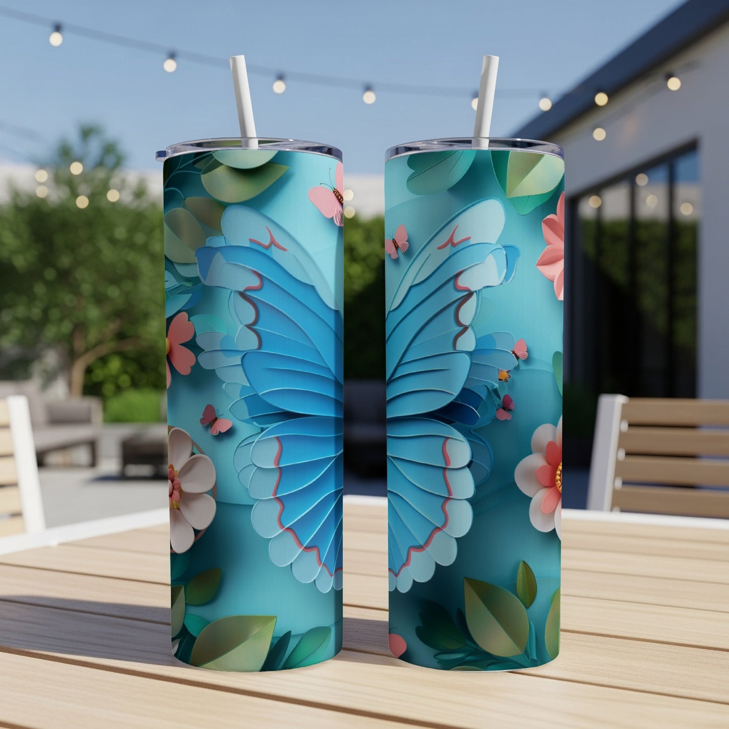 Two teal tumblers with large blue butterfly and floral designs.