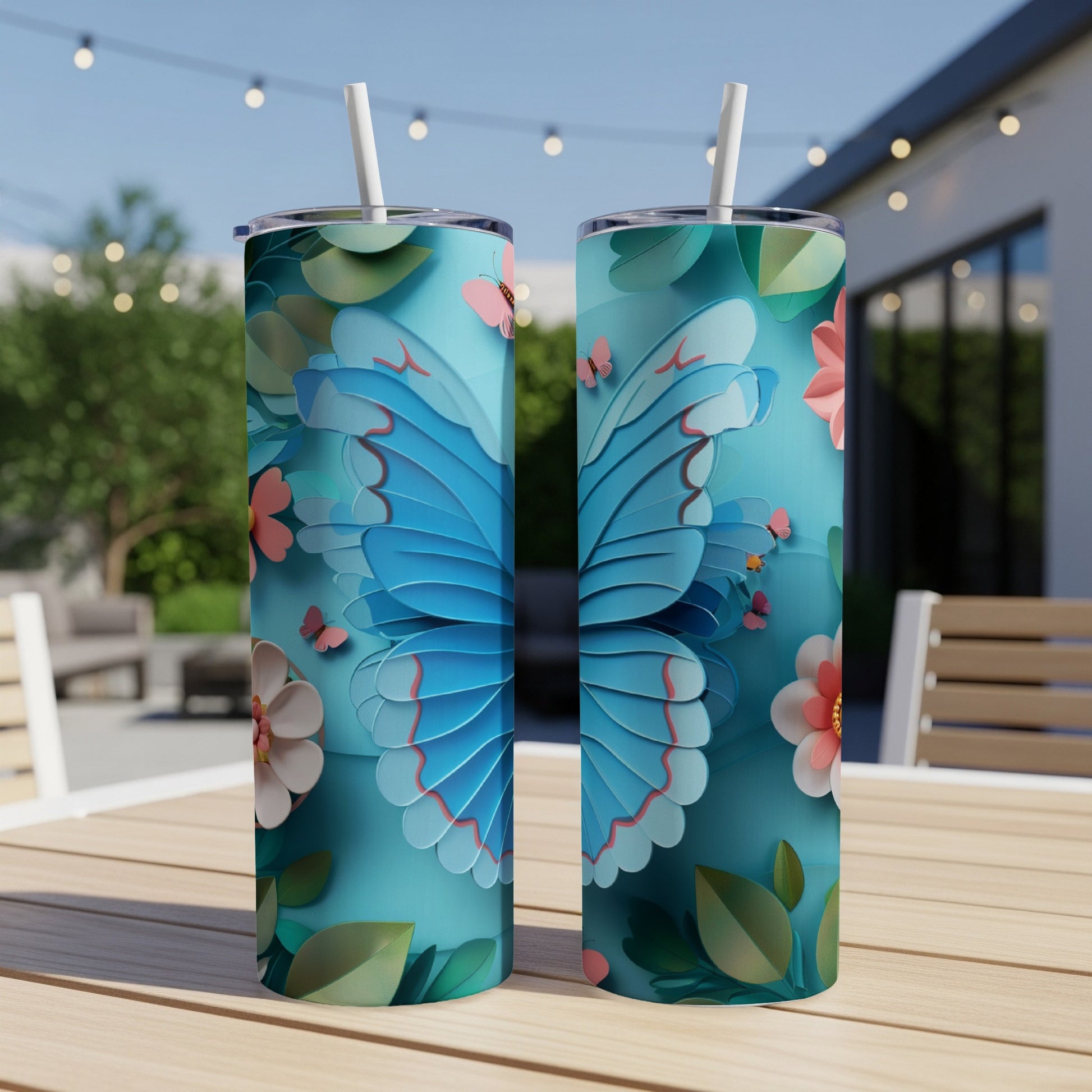 Two teal tumblers with large blue butterfly and floral designs.