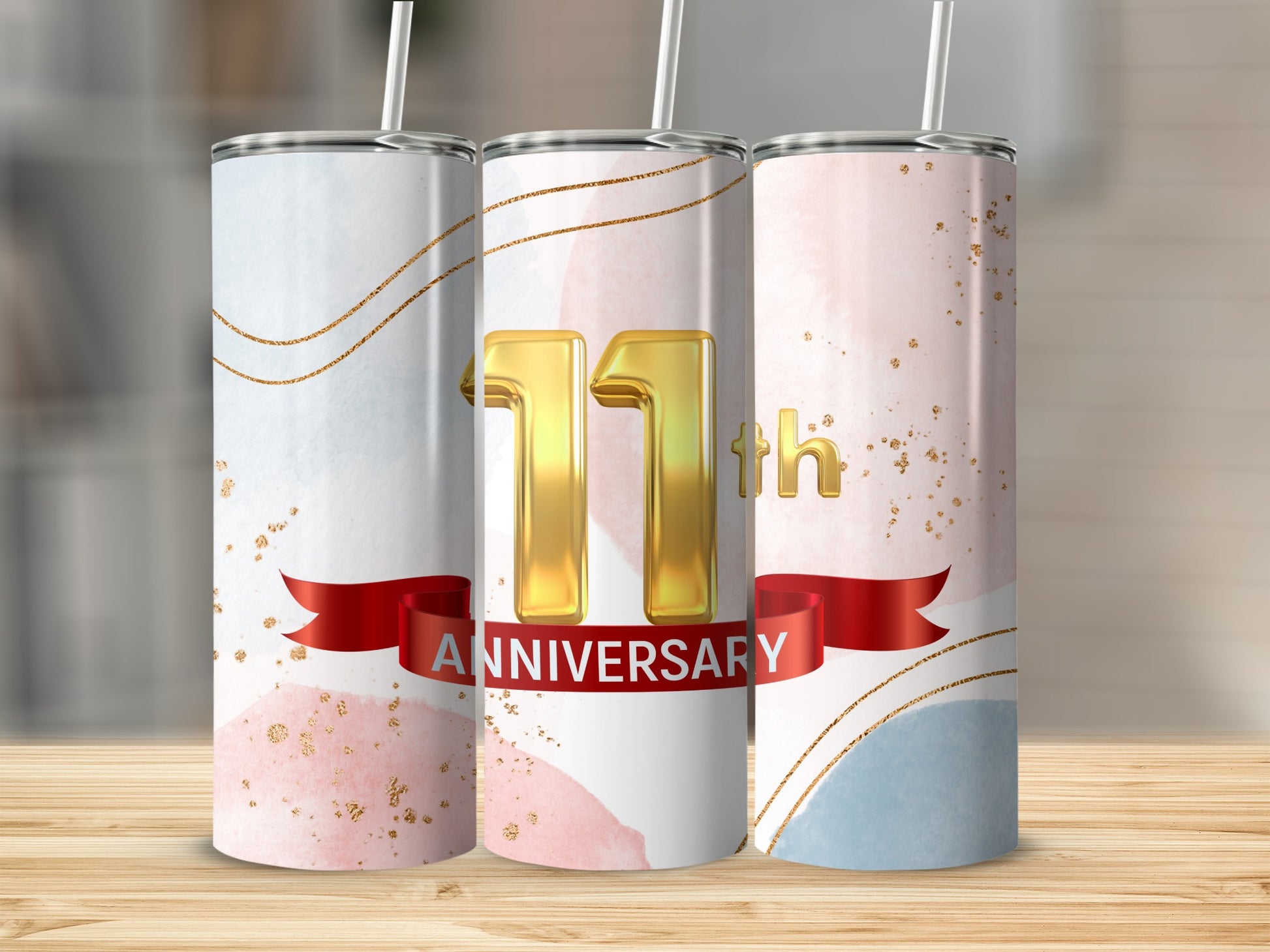 Three tumblers with "11th Anniversary" text and watercolor design.