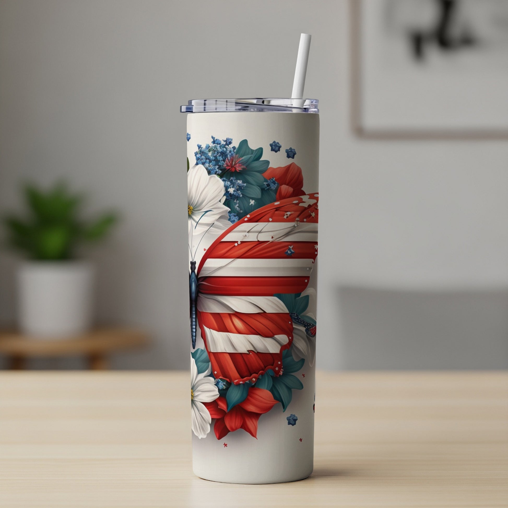 Tall tumbler with a butterfly design featuring red, white, and blue stripes and floral accents.