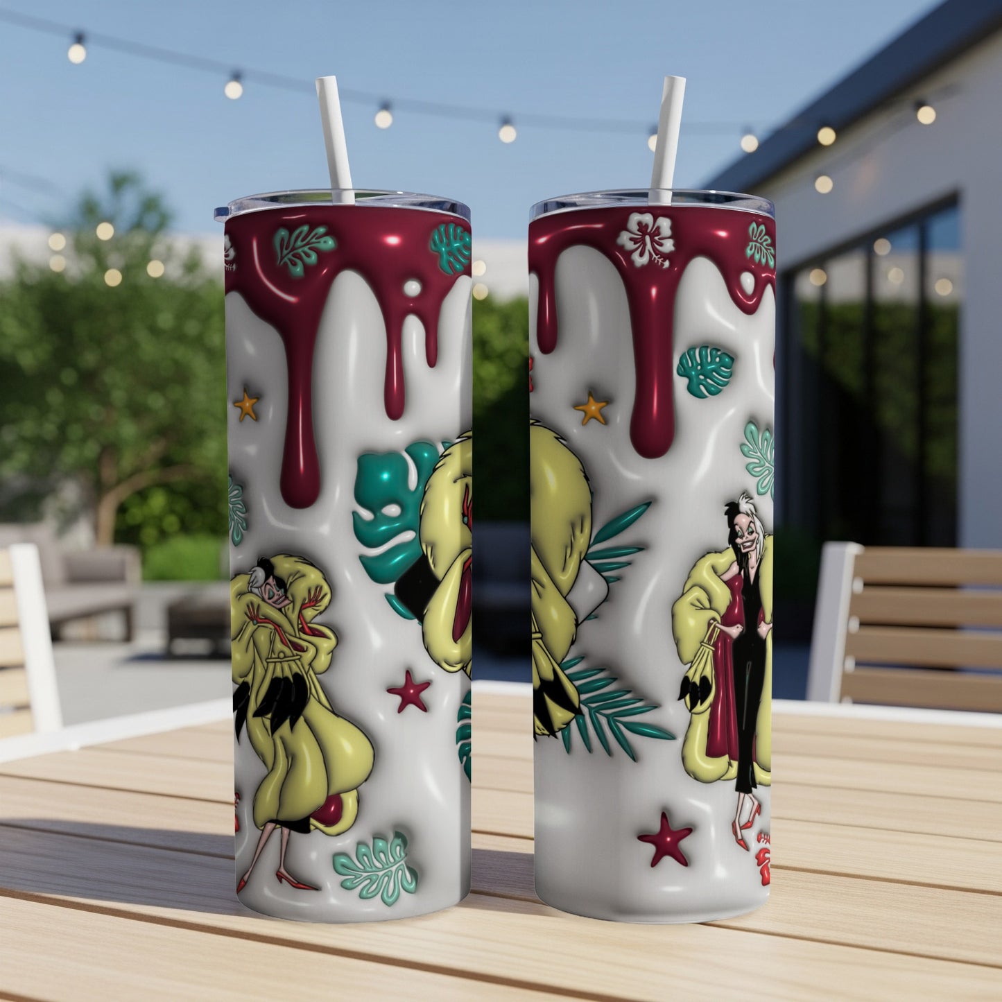 Two tumblers with Cruella de Vil and tropical motifs.