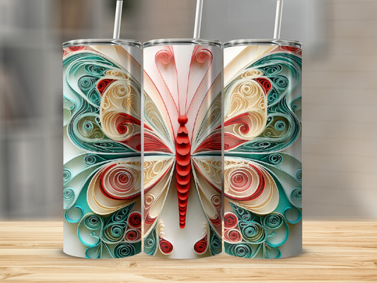 Three tumblers featuring colorful paper quilled butterflies on a wooden surface.