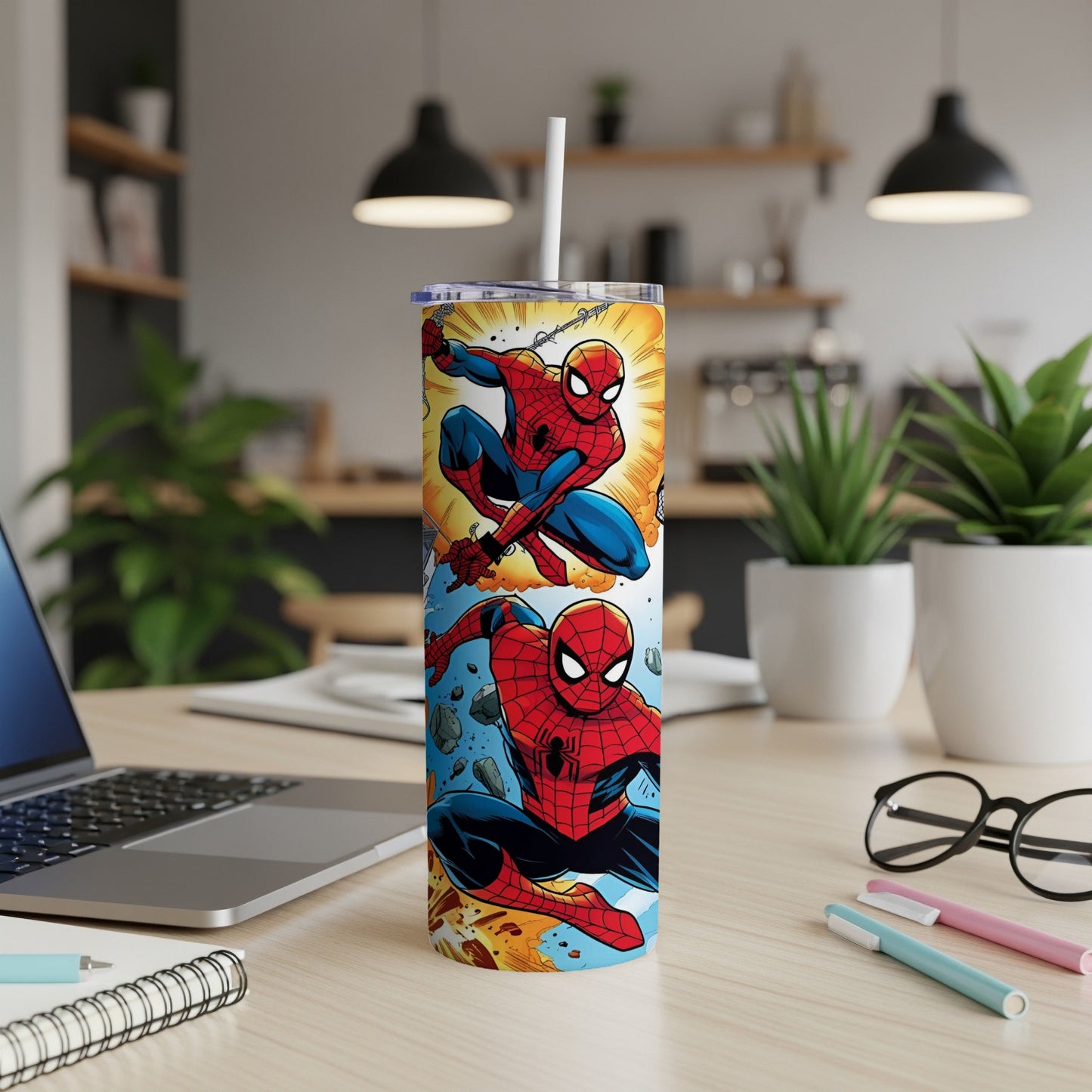 Spider-Man tumbler with two comic-style illustrations on a desk.