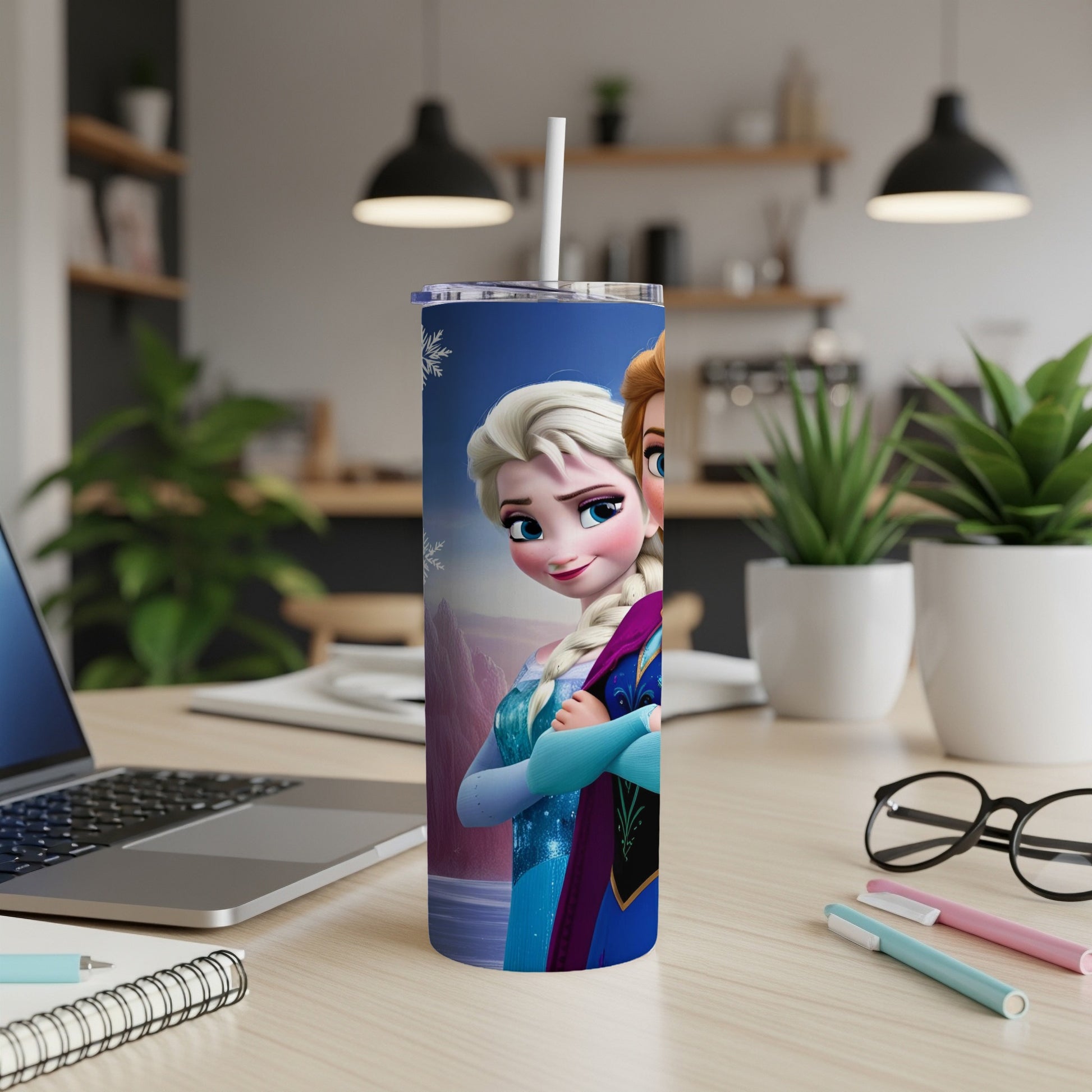 Frozen's Elsa and Anna on a blue and white patterned tumbler.