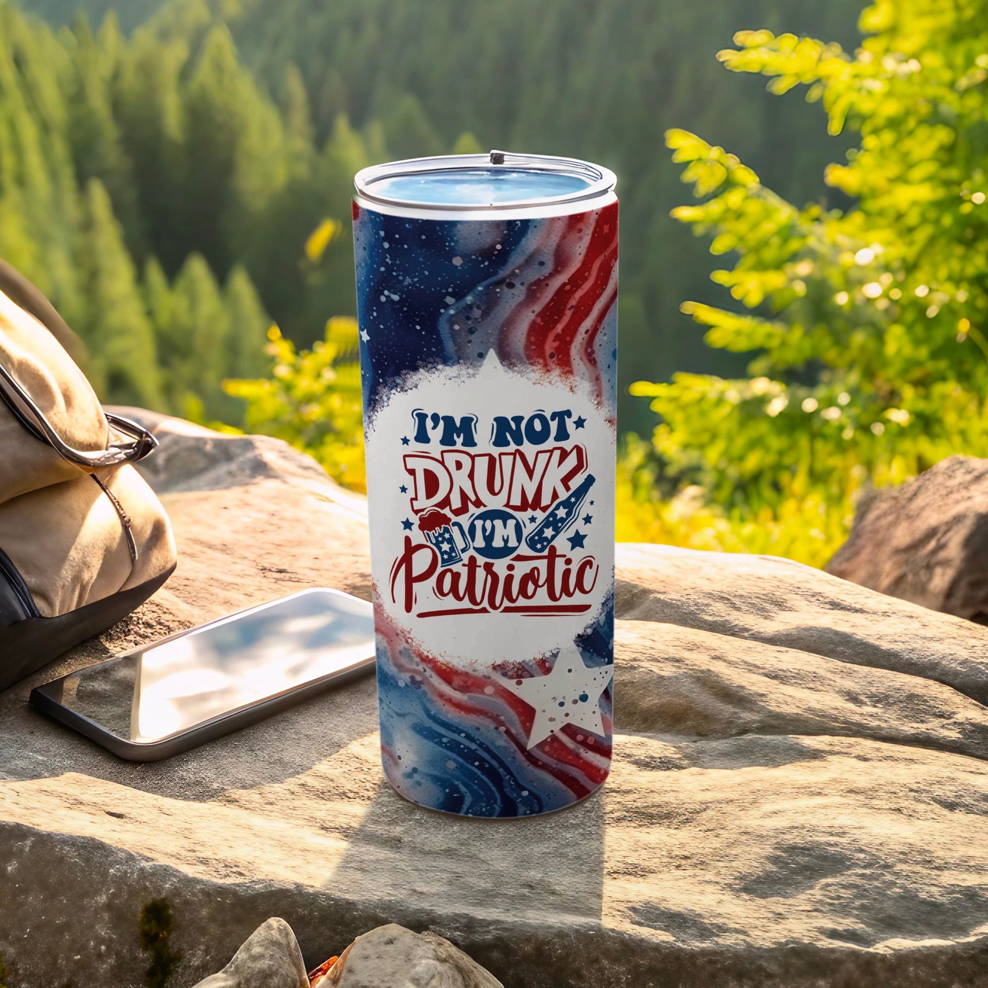 Tumbler with "I'm Not Drunk Patriotic" text, abstract American flag design.
