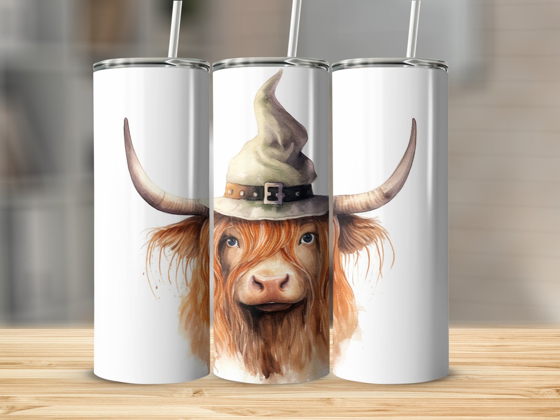 Highland cow wearing a witch hat on a white tumbler.