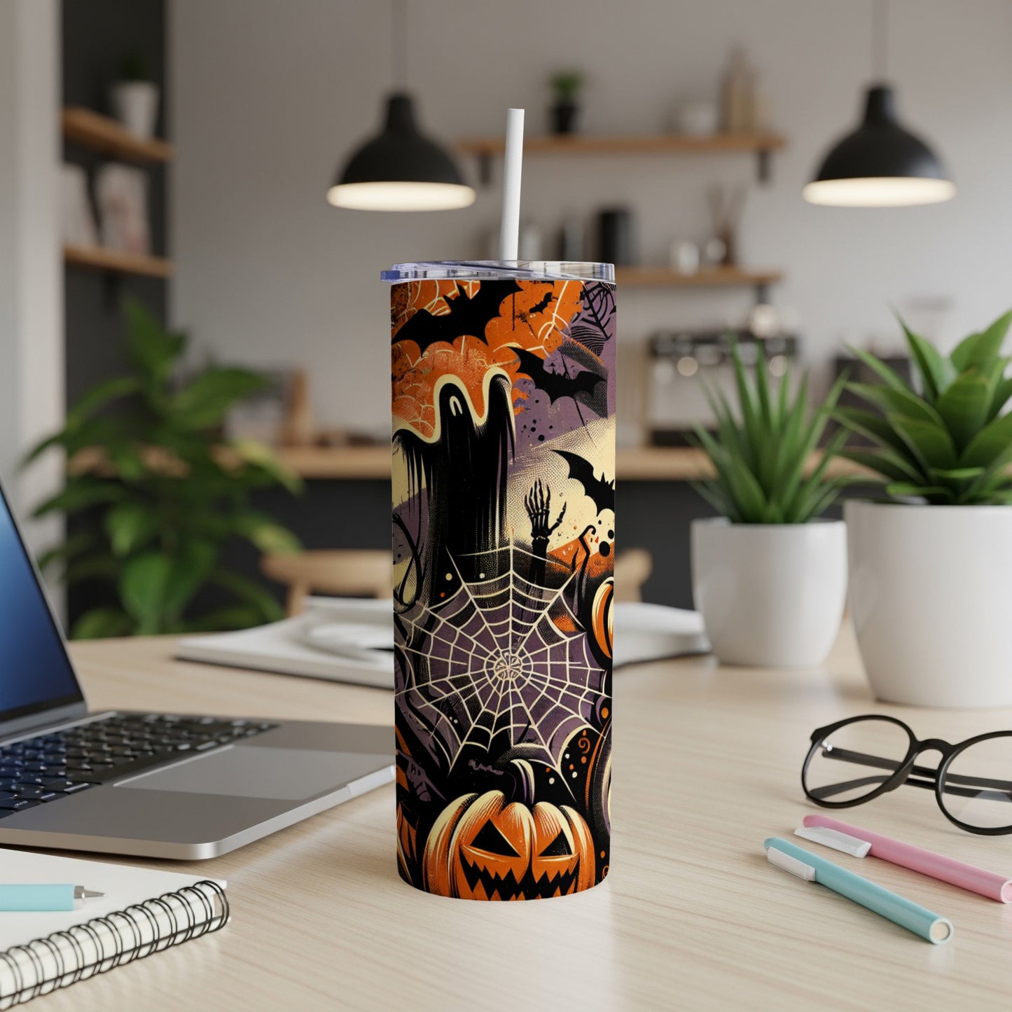 Halloween tumbler with ghost, bats, spiderweb, and jack-o'-lantern design.