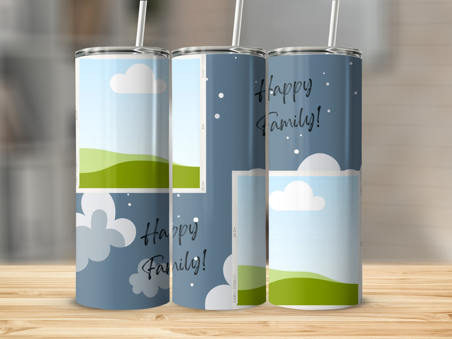 Three tumblers with "Happy Family!" text and a cloud and landscape design.