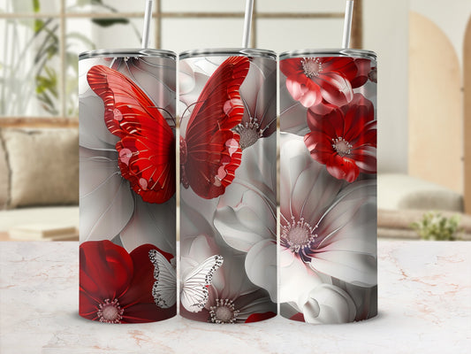 Three tumblers with red butterflies and white flowers design.