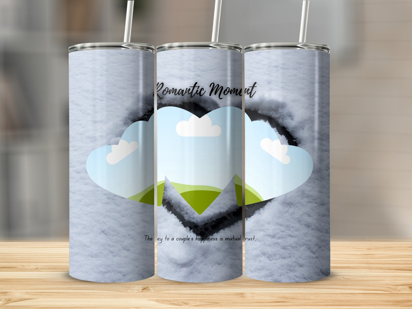 Three tumblers with a snow background, heart shape, and text: "Romantic Moment".
