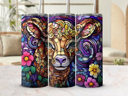 Colorful stained glass tumbler with a cow and floral design.