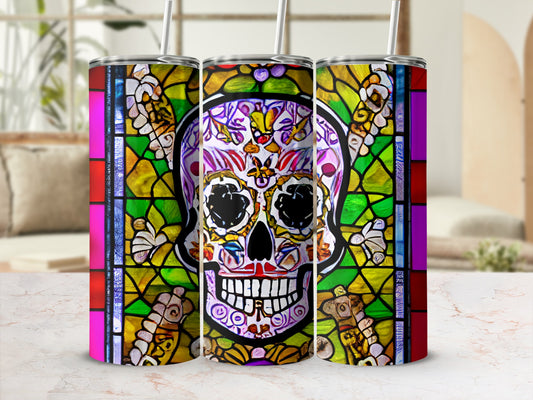 Three tumblers with a stained glass skull design, with straws.